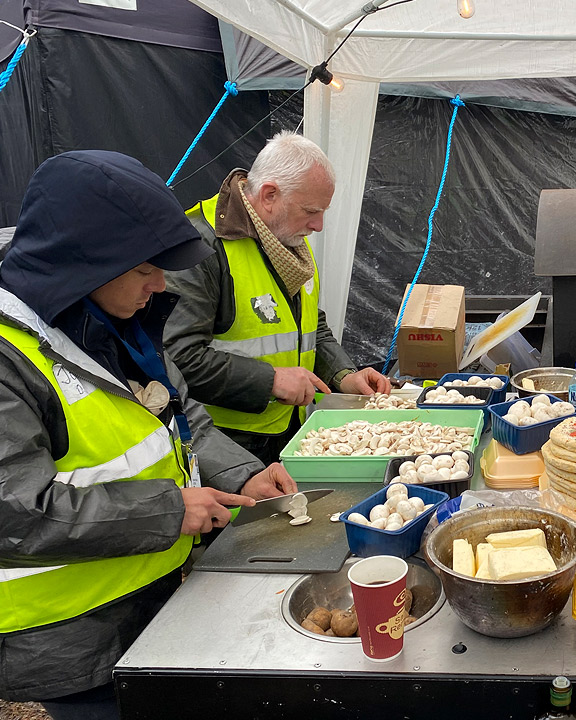 Volunteers making food for refugees